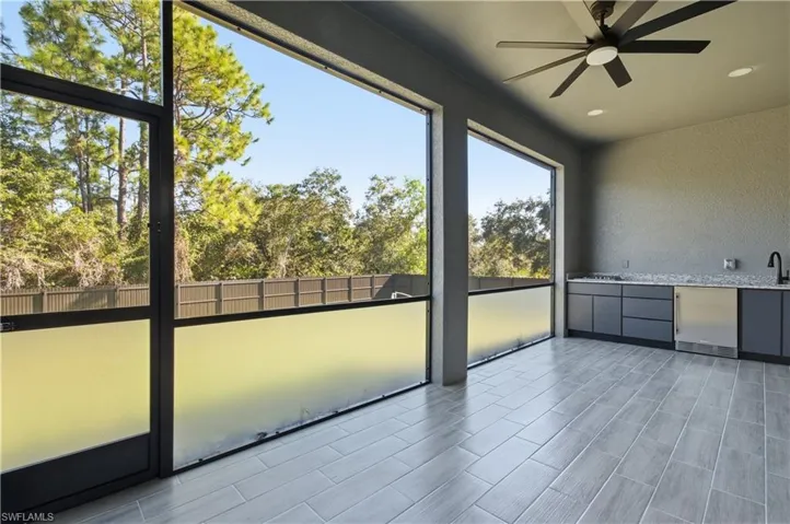 Unfurnished sunroom with a sink