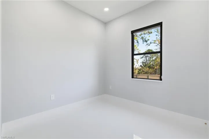 Empty room featuring recessed lighting