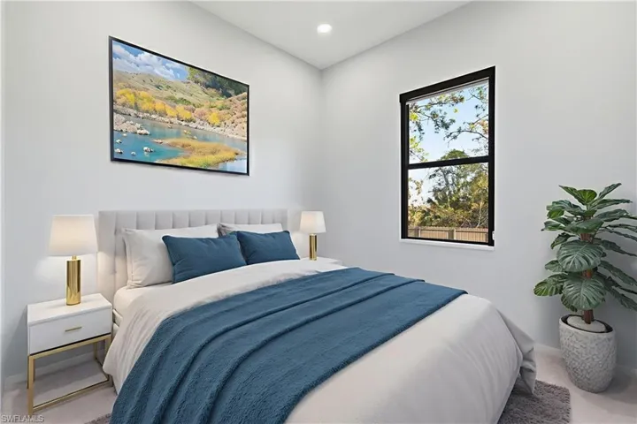 Carpeted bedroom featuring baseboards and recessed lighting
