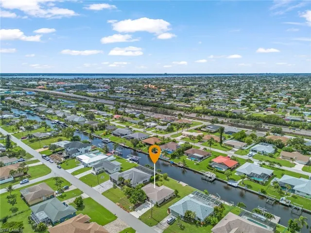 Aerial view of residential area with a large body of water
