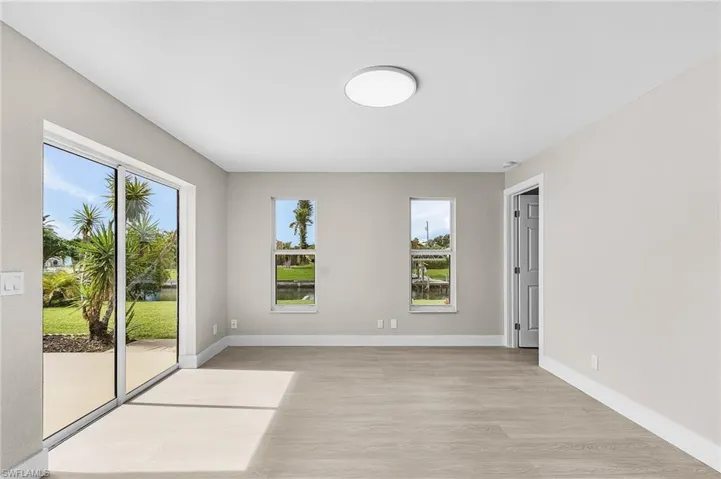 Empty room featuring light wood finished floors and baseboards