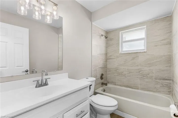 Full bath with shower / bath combination and vanity