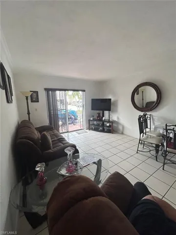 Living room with light tile patterned floors