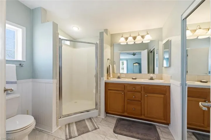 Walk-in shower with dual sinks