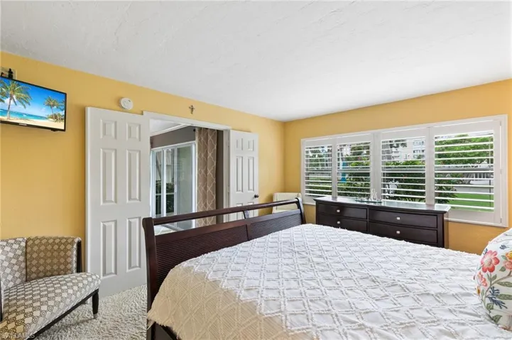 French doors lead in, carpet in both bedrooms
