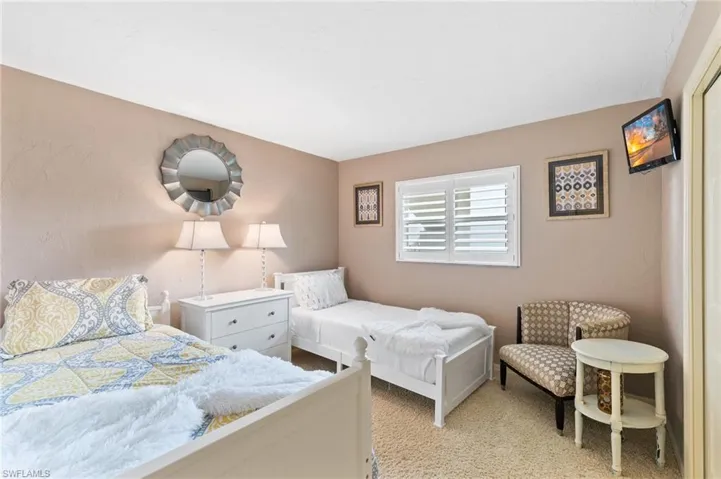 Versatile guest room with ample storage in closet