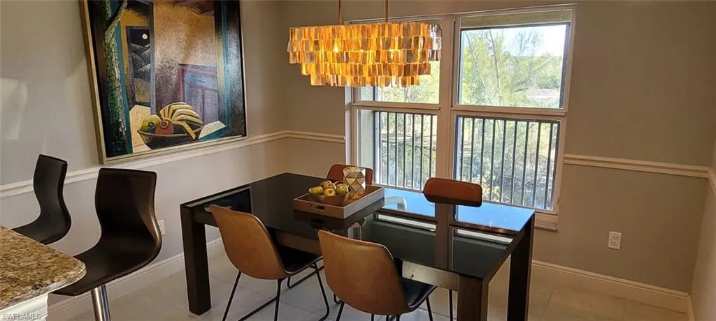 Tiled dining area with baseboards