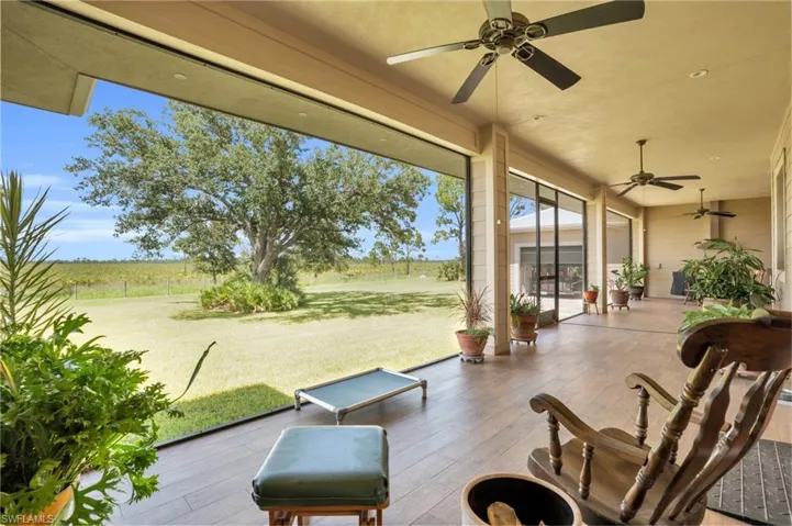 View of patio with french doors and ceiling fan