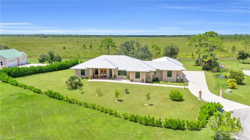 Birds eye view of property with a rural view