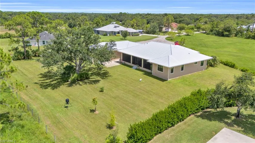 Birds eye view of property with a rural view
