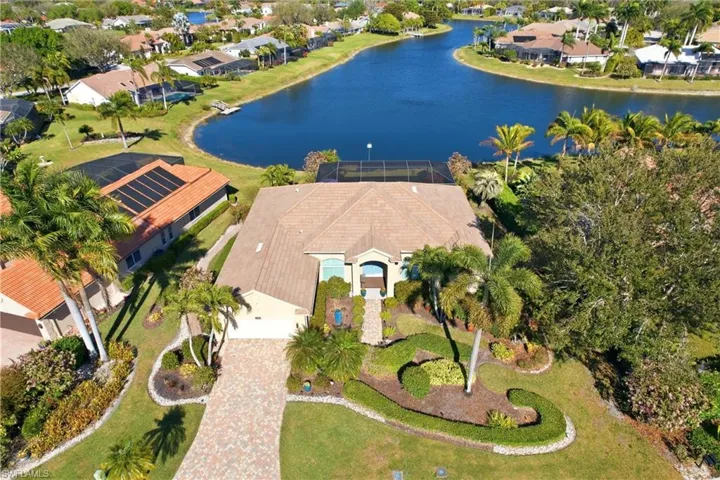 Aerial view of residential area with a nearby body of water