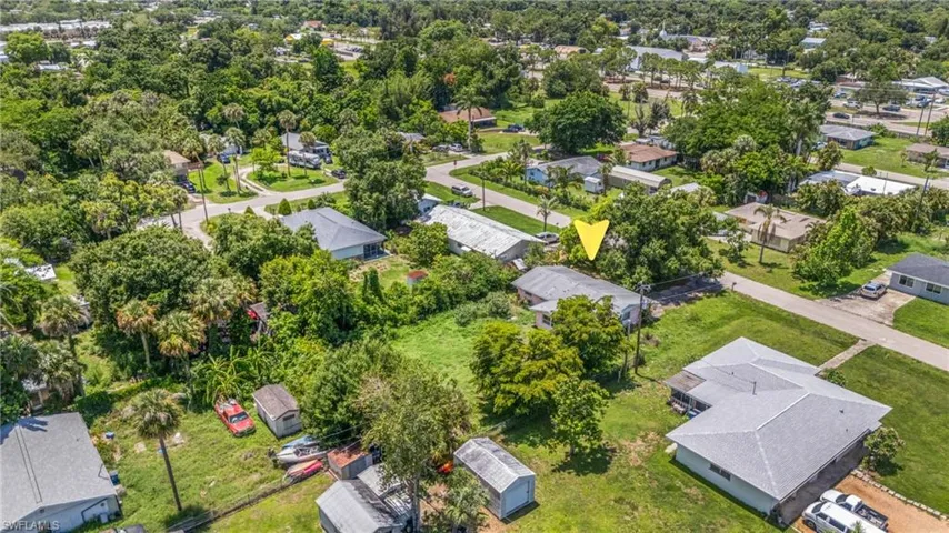 Aerial view of residential area with a tree filled landscape