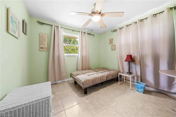 Bedroom featuring ceiling fan and light tile patterned floors