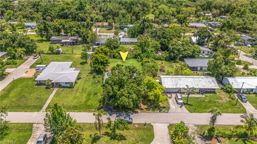 Aerial overview of property's location with nearby suburban area