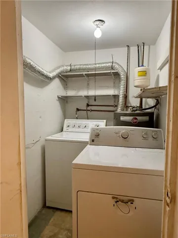 Laundry area with independent washer and dryer and water heater