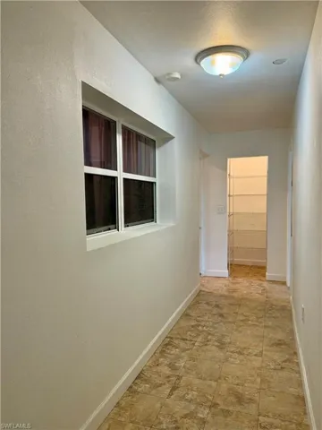 Hallway off kitchen to laundry showing kitchen pantry