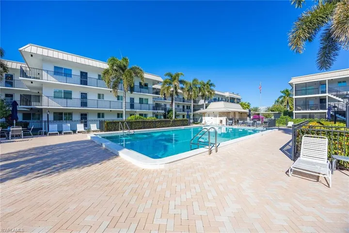 Community pool with a patio area