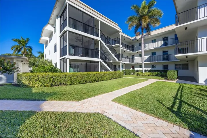 View of apartment building / complex featuring stairs