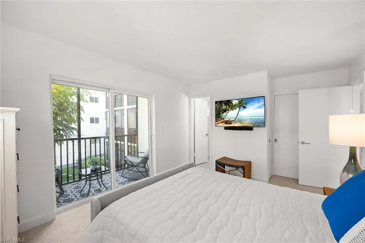 Carpeted bedroom featuring baseboards