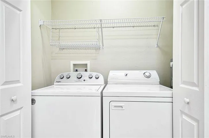 Laundry area with washing machine and clothes dryer