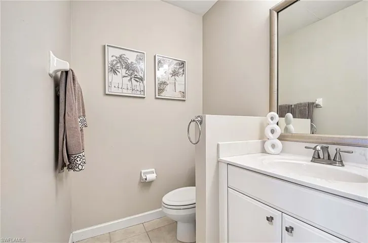 Bathroom with vanity and light tile patterned flooring