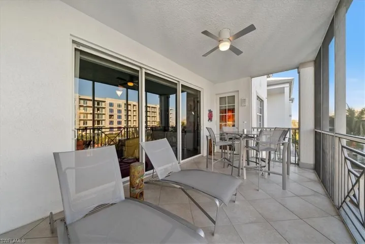 Sunroom featuring ceiling fan