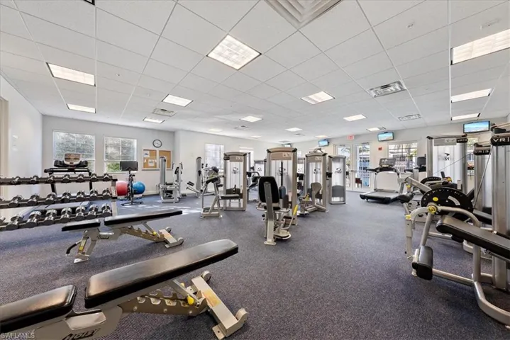 Workout area featuring a drop ceiling
