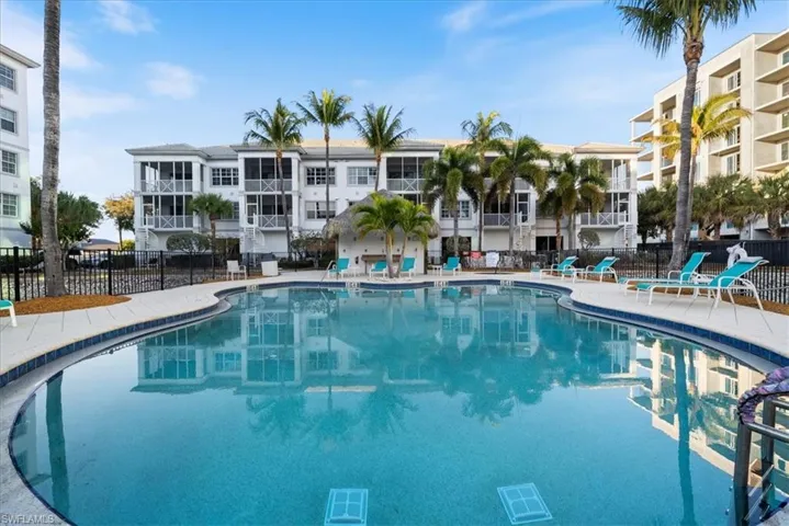 Community pool with a patio