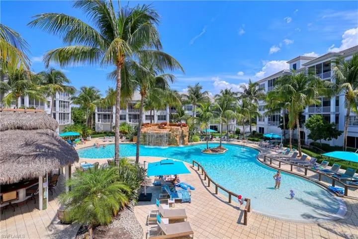 Community pool featuring a patio