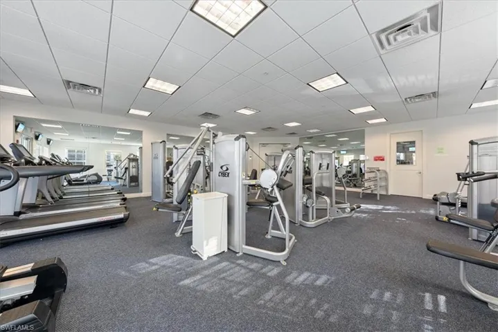 Exercise room with a paneled ceiling