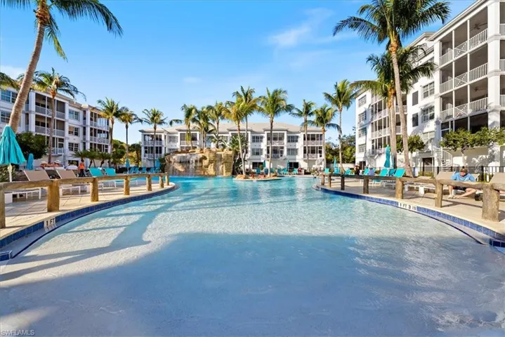 Community pool with a patio