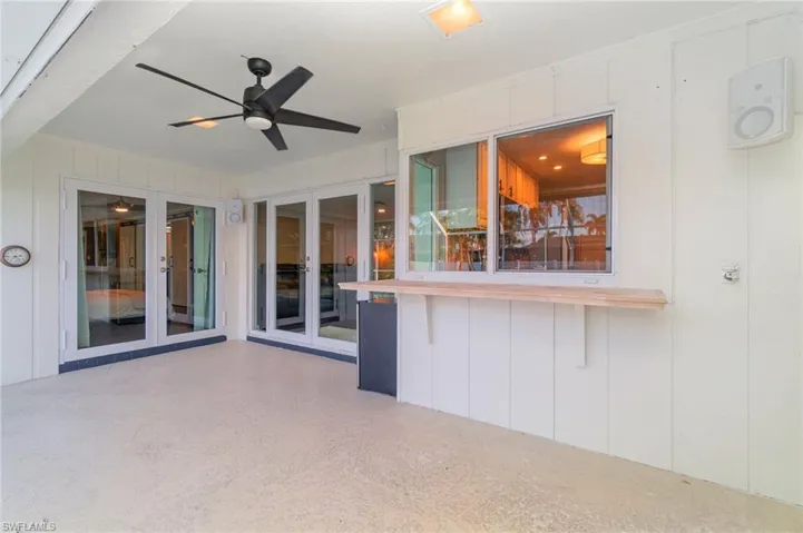 View of patio with french doors and ceiling fan