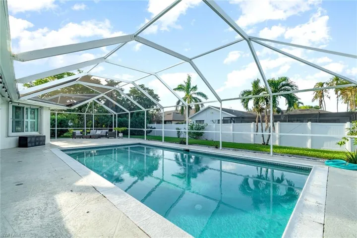 View of pool featuring a patio area, a lanai, and an outdoor living space