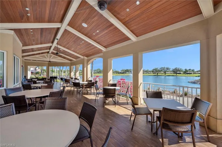 Main clubhouse outdoor dining area overlooking lake and golf