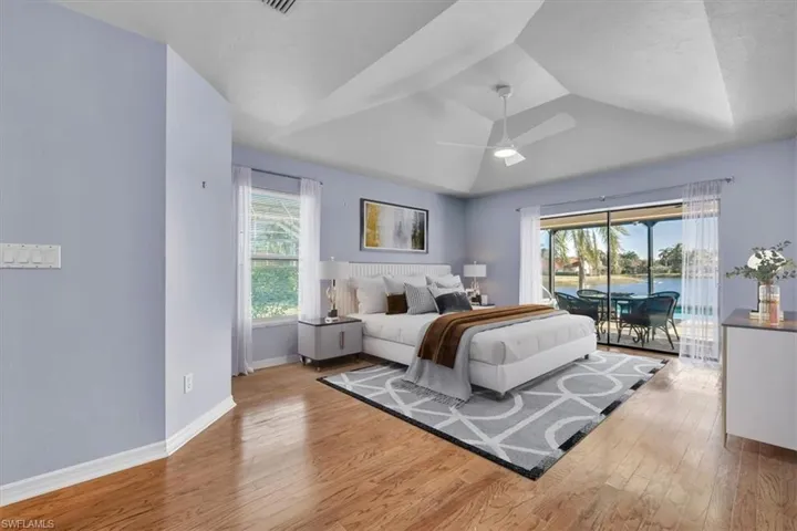 Staged Primary Bedroom  with both a Pool and Lake view!