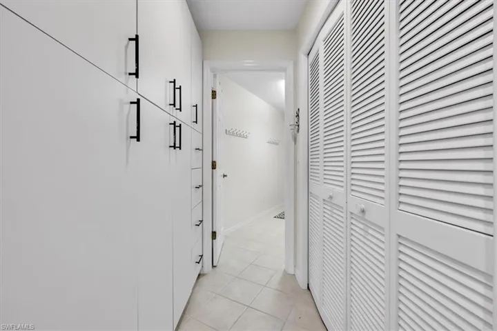 Pantry Closet and Storage Cabinets between Kitchen and Laundry