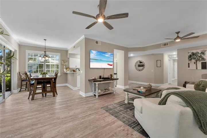 Great room with room for stools at breakfast bar.Great room with easy direct kitchen access.