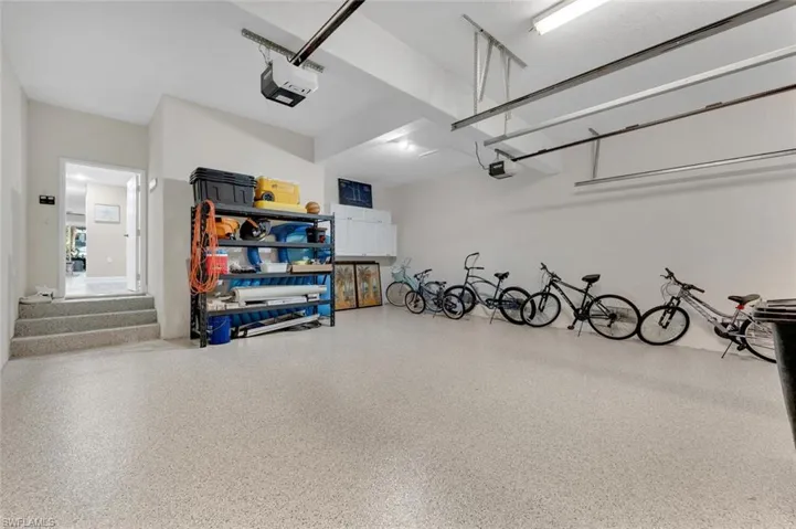 2 car garage w/extra storage, Epoxy floor, & electric openers.