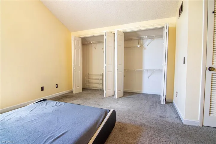 Large window and high vaulted ceiling provide lots of natural light!
