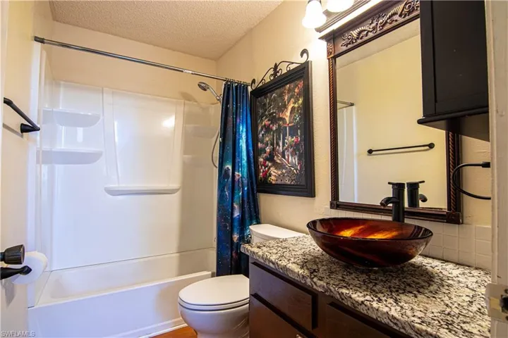 Nicely updated with sophisticated counters, vessel sink and fixtures!