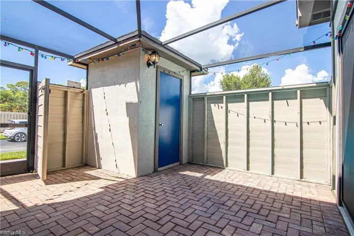 Enter into the private front screened courtyard
