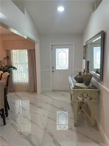 Entryway featuring lofted ceiling