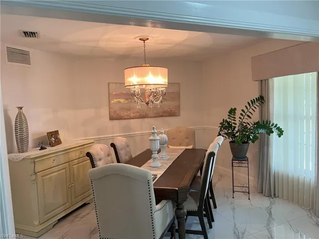 Dining area with an inviting chandelier