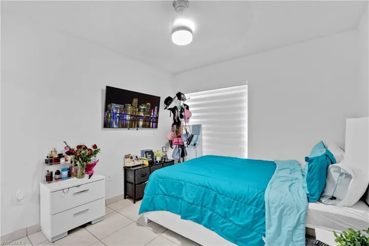 Bedroom featuring light tile patterned flooring