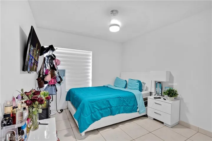 Bedroom featuring light tile patterned flooring