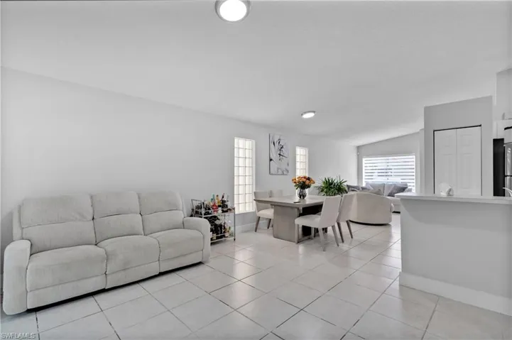 Tiled living room with vaulted ceiling