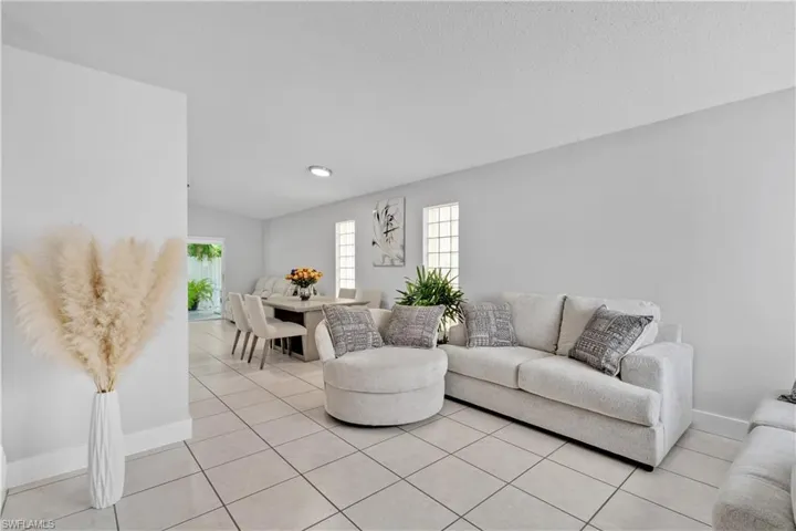 Living room with light tile patterned floors