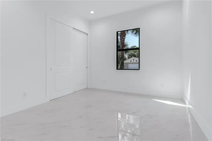 Unfurnished room featuring light tile patterned floors