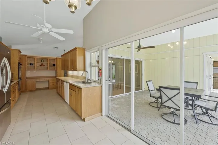 Home features wood cabinet and tile flooring throughout the main living areas.