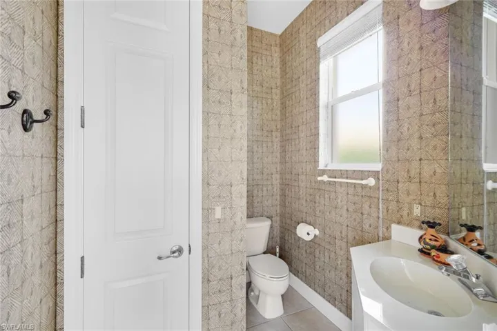 Pool Bath Located From the Lanai, With Large Storage Closet